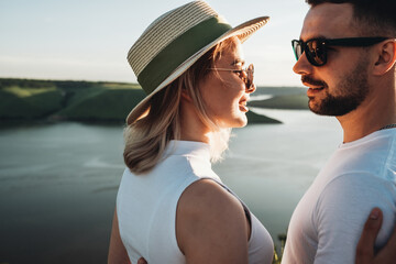 Two Young and Happy Travelers Hugging Next to the Canyon