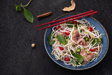 space meat with vegetable noodle Vietnam with red chopstick food background