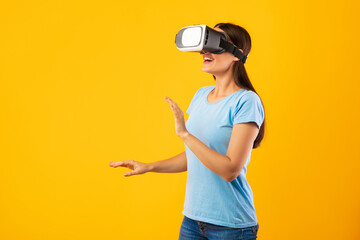 Woman wearing virtual reality goggles at the studio