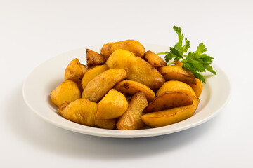 fried potatoes on a white plate