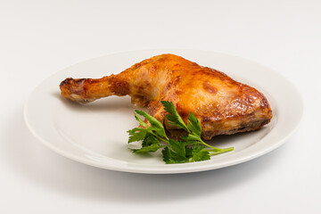 fried chicken leg with on a white plate