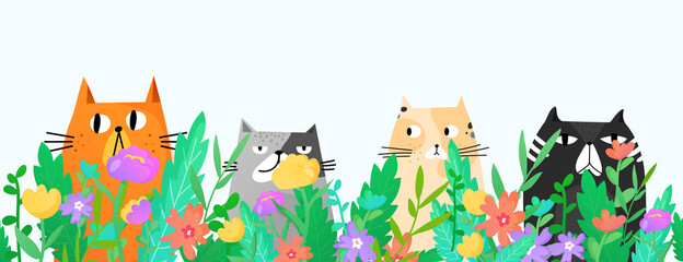 Funny cats sitting in the grass and flowers.