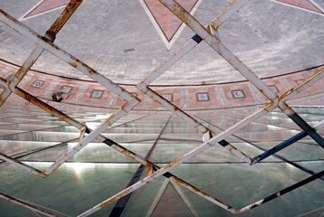 The rusty fence and view through it