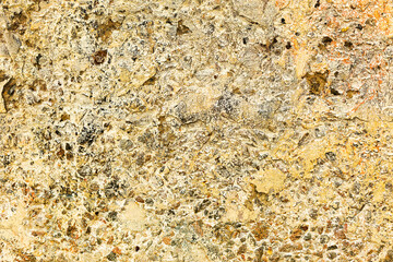 Great colorful background or texture. Abstract concrete is aged with cracks, scratches and remnants of old paint in different shades. Rough concrete surface