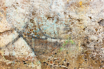 Abstract creative background of chaotic strokes of old cracked paint on concrete wall. Old surface with traces of paint, weathered, scratches and cracks for design