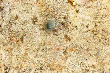 Great colorful background or texture. Abstract concrete is aged with cracks, scratches and remnants of old paint in different shades. Rough concrete surface