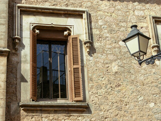 Fototapeta na wymiar View of an old stone wall with a window