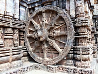 The Wheel of Sun Temple of Konark, India which doubles up as a sun dial. Ancient rock cut art of...