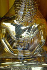 close up of head of statue of buddha, in buddhist temple ,with golden color