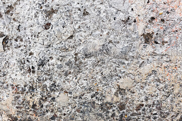 Background concrete wall, traces of weathering, worn wall damaged paint old paint. Remains of old paint on the painted concrete surface. Grungy concrete surface.