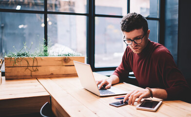 Man freelancer surfing net searching information for presentation