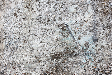 Background concrete wall, traces of weathering, worn wall damaged paint old paint. Remains of old paint on the painted concrete surface. Grungy concrete surface.