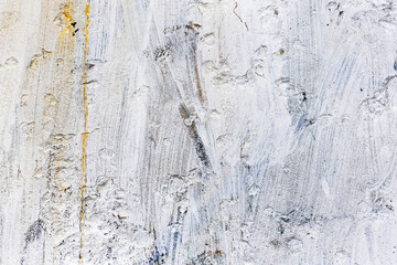 Background concrete wall, traces of weathering, worn wall damaged paint old paint. Remains of old paint on the painted concrete surface. Grungy concrete surface.