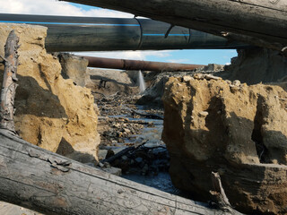 Environmental pollution. Industrial accident. Water flows out of the pipe.