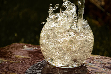 splash of water in a glass jar of water