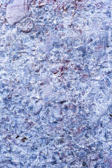 Background concrete wall, traces of weathering, worn wall damaged paint old paint. Remains of old paint on the painted concrete surface. Grungy concrete surface.