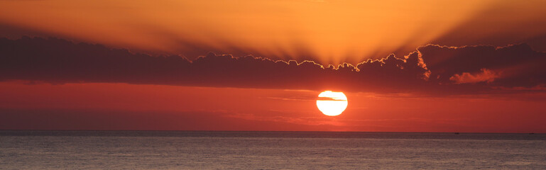 Sun rays over the sea panorama