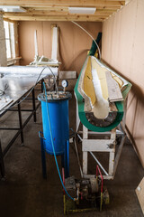 Workshop with equipment for making wind generator blades, using the vacuum infusion method. The picture was taken in Russia, in the Orenburg region, in the production room of an industrial enterprise