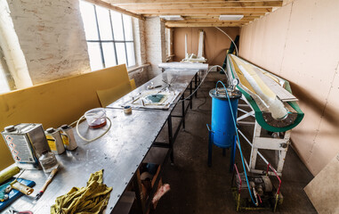 Workshop with equipment for making wind generator blades, using the vacuum infusion method. The...