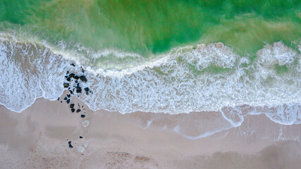 Aerial panoramic drone view of blue ocean waves and beautiful beach
