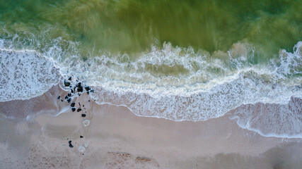 Fototapeta na wymiar Aerial panoramic drone view of blue ocean waves and beautiful beach