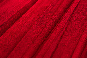 Bright beautiful red paper texture background selective focus