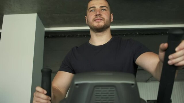 Professional athlete does cadre training on orbitrek. Preparation for competitions
