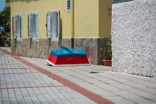 An inverted boat on the street near a house in a small village, Valle gran rey, La Gomera, Spain