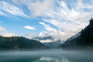 Foggy mist lake and mountain with clouds in Northern Cascades Pacific Mountain Range National Park Washington, USA