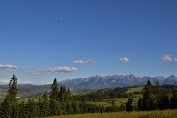 Tatra Mountains panorama. Gorgeous mountain range with high rocky peaks. Beautiful view from Kotelnica mountain. Bialka Tatrzanska, Podhale, Poland. High Tatra summits.