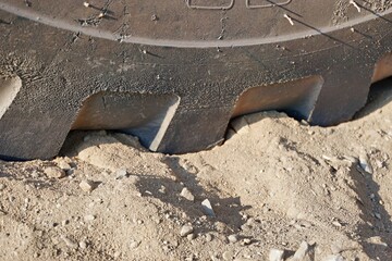 Baggerreifen im Sand
