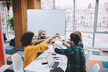 Partnership concept of successful multicultural young people dressed in casual wear in...