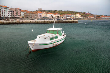 Wooden fishing boat in the port in front of Senj, Croatia
