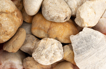 close-up of  abstract background with  pebble stones.
Texture of white stones.