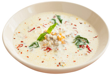 Soup with sausages, spinach, vegetables and coconut milk