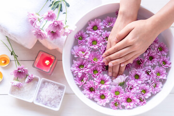 Obraz na płótnie Canvas Spa beauty massage health wellness. Spa Thai therapy treatment aromatherapy for nail and hands woman with pink flower nature candle for relax a