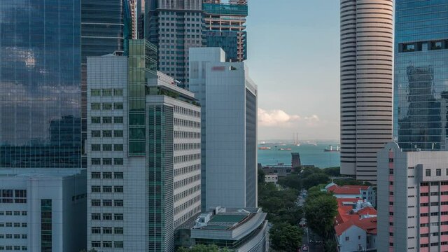Aerial cityscape of Singapore downtown of modern architecture with skyscrapers timelapse, view from above in chinatown district before sunset