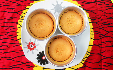 Top view of Metal Cups of tasty Beans Cake or Nigerian Moi Moi 