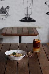 orange coffee with italian food.