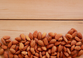 Almonds isolated wood background