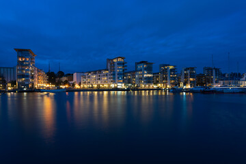 Fototapeta na wymiar North harbour with luxury apartments in the coastal city Helsingborg during night-time.