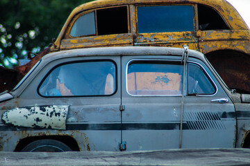 Old Soviet cars in disassembled condition, the body of old rare cars