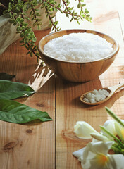 Fototapeta na wymiar Sea salt in wooden bowl and spoon 