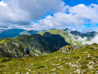Fototapeta na wymiar Hikers on The Key of the Banda Peak, Fagaras Mountains, Romania
