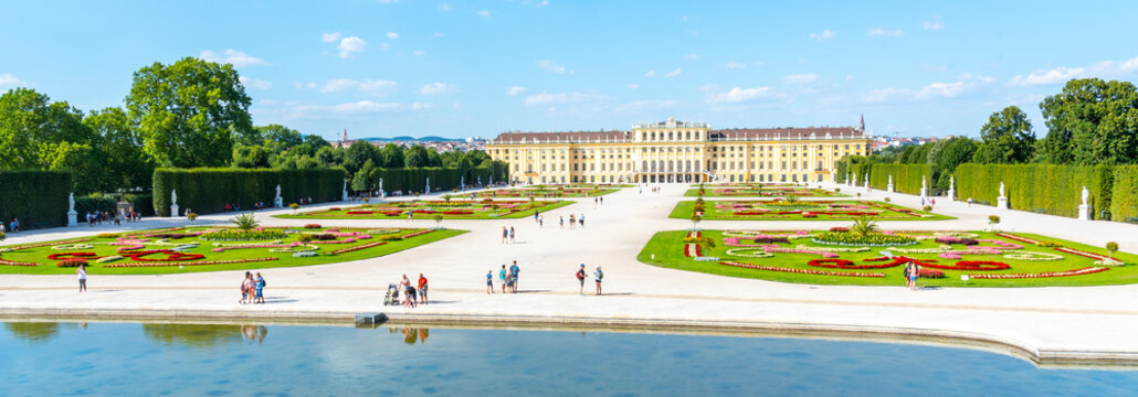 VIENNA, AUSTRIA - 23 JULY, 2019: Schonbrunn Palace, German: Schloss Schonbrunn, and Great Parterre - French Garden with beautiful flower beds, Vienna, Austria.