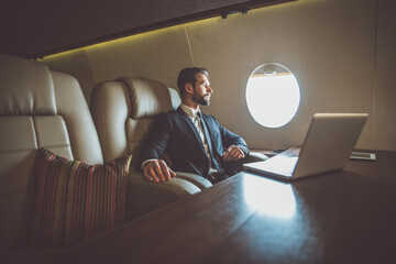 Businessman flying on his private jet