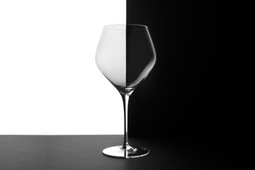 Wine glass on white and black