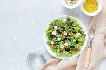 Salad with beetroot, feta cheese and walnuts. Healthy eating.