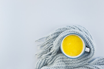 Golden milk and on a blue background. Masala Haldi Doodh. Alternative medicine concept