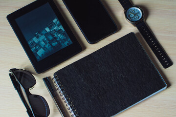 glasses, notebook, devices and watches